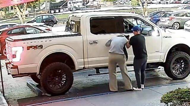 Security camera footage shows a man forcing a woman into a Ford F-150 pickup truck Wednesday morning, Dec. 31, 2025.